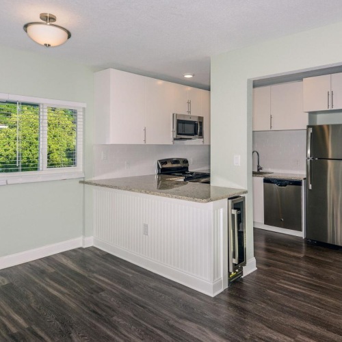 a kitchen with white cabinets