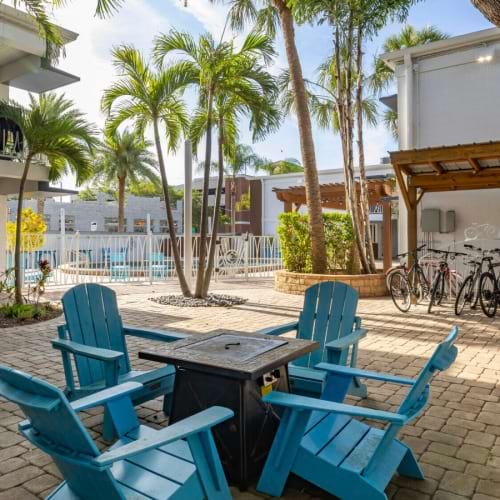 a patio with chairs and tables
