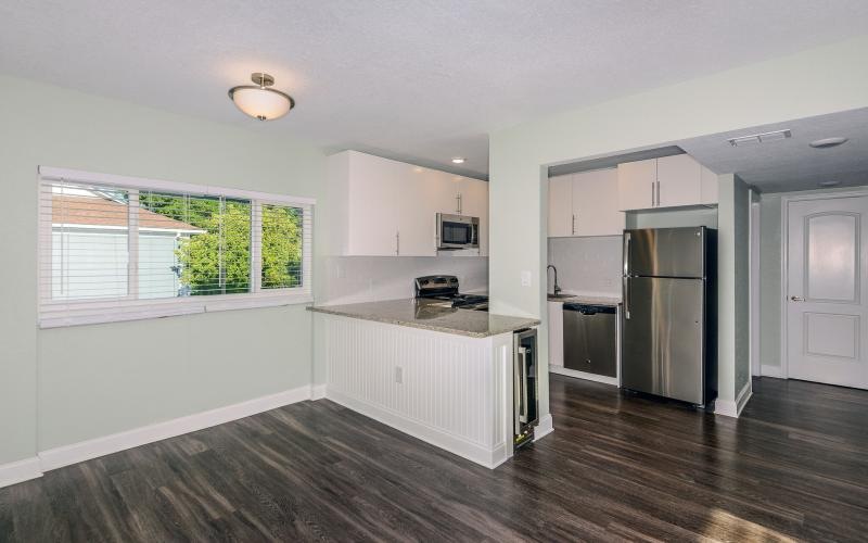 a kitchen with white cabinets