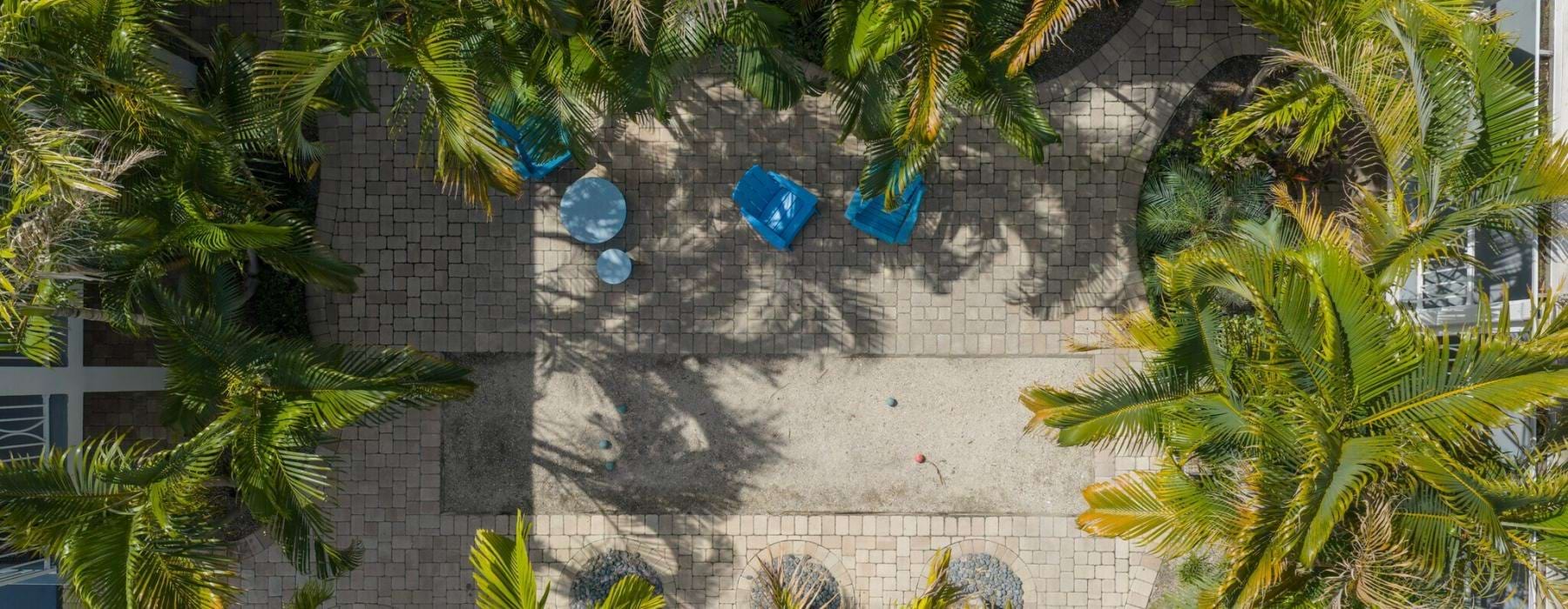 aerial view of a courtyard with palm trees