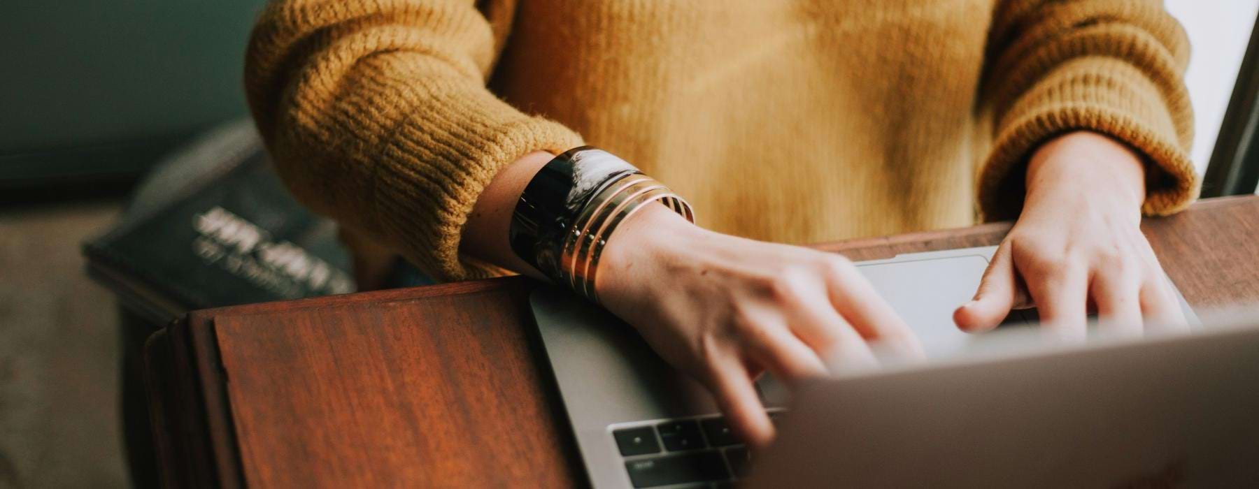 a person typing on a laptop